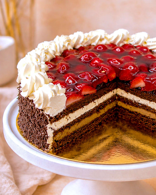 Chocolate Strawberry Gateau adorned with fresh strawberries and whipped cream layers, perfect for celebrations.