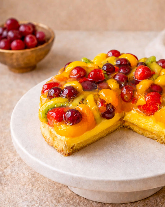 Fruit Flan with creamy custard and colorful seasonal fruits on a pastry base, perfect for every occasion.